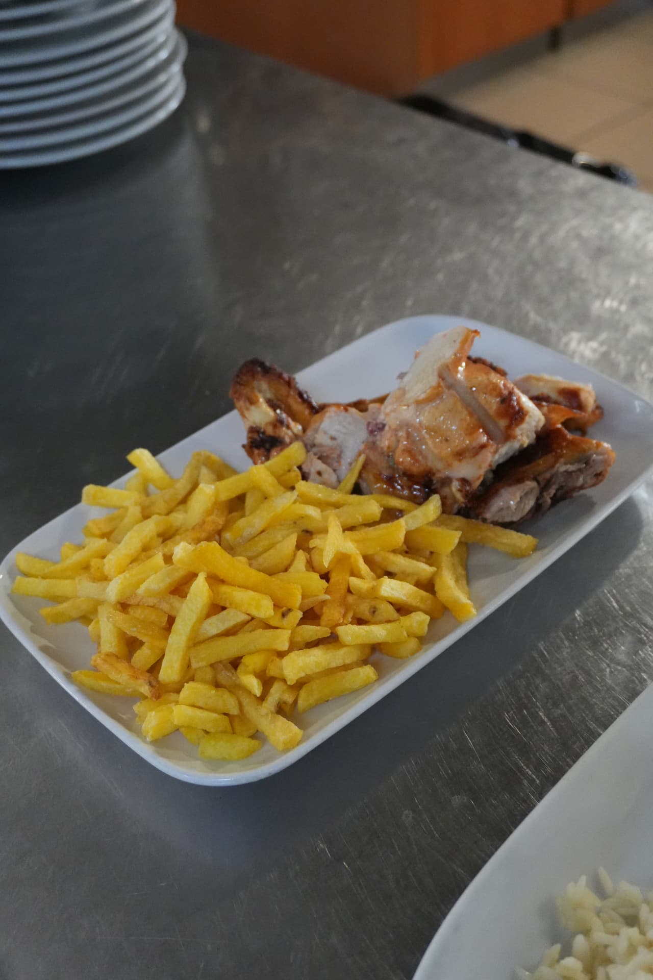 Dindão roast chicken with fries, original photograph taken during service