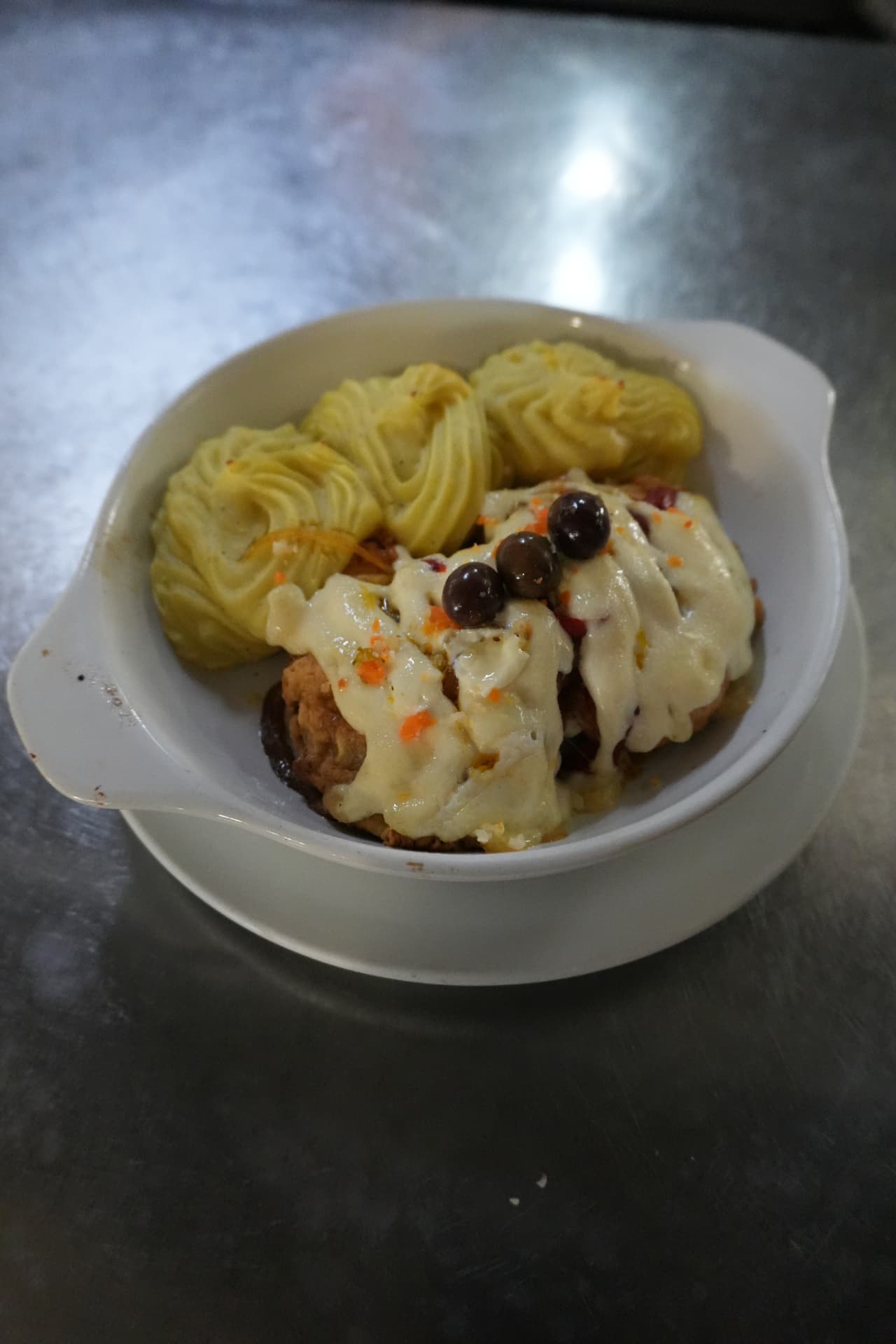 Dindão baked dish with mashed potato, original photograph taken during service